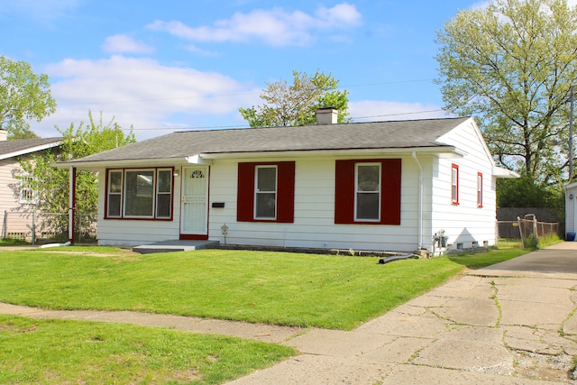 view of front of property with a chimney and roof with shingles