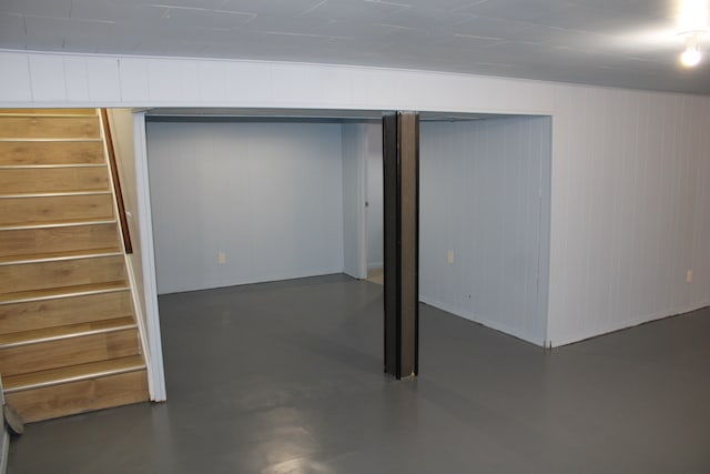 finished below grade area featuring stairway