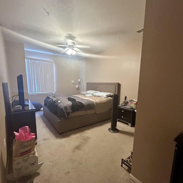 bedroom featuring carpet floors and a ceiling fan
