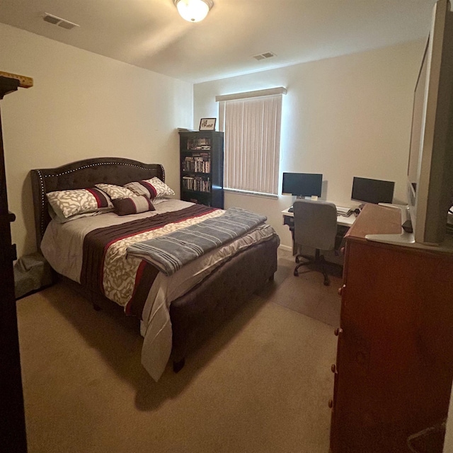 bedroom featuring carpet flooring and an office area