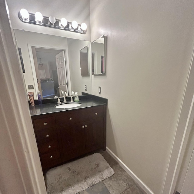 bathroom with baseboards and vanity