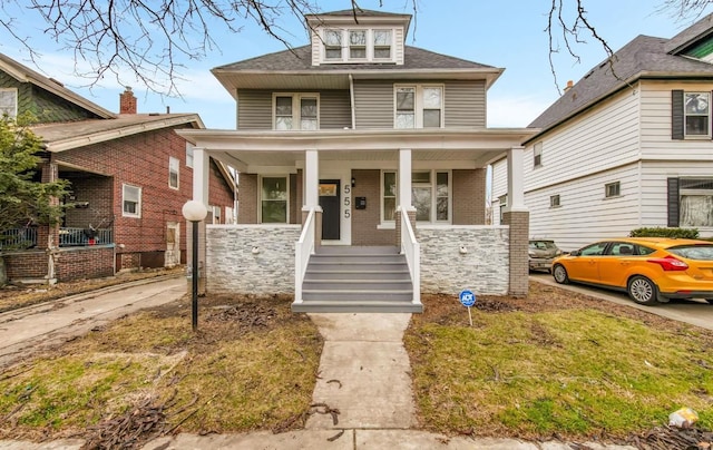 555 Josephine St, Detroit, MI 48202 - american foursquare style home featuring a porch and brick siding