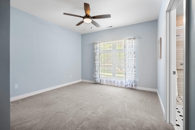611 Woodland Dr, Dexter, MI 48130 - empty room with ceiling fan, carpet, and baseboards