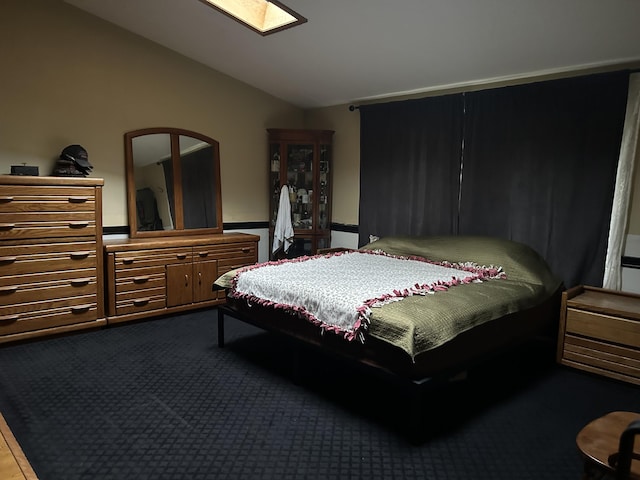 29 Douglas Ave, Coldwater, MI 49036 - bedroom with lofted ceiling, dark carpet, and a skylight