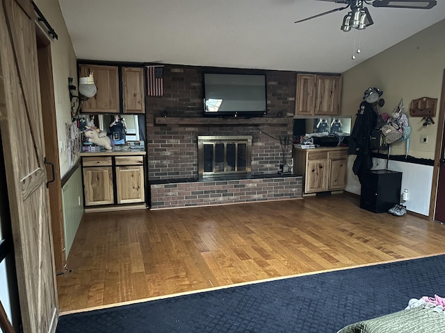 29 Douglas Ave, Coldwater, MI 49036 - kitchen with dark wood-type flooring, ceiling fan, and a brick fireplace