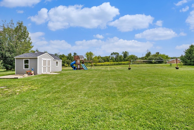 7812 Fountain Hills Ln, Davisburg, MI 48350 - view of green lawn with a playground and an outdoor structure