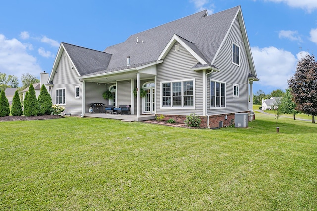 7812 Fountain Hills Ln, Davisburg, MI 48350 - back of house with a yard, roof with shingles, and a patio