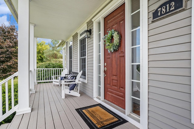 7812 Fountain Hills Ln, Davisburg, MI 48350 - property entrance with a porch