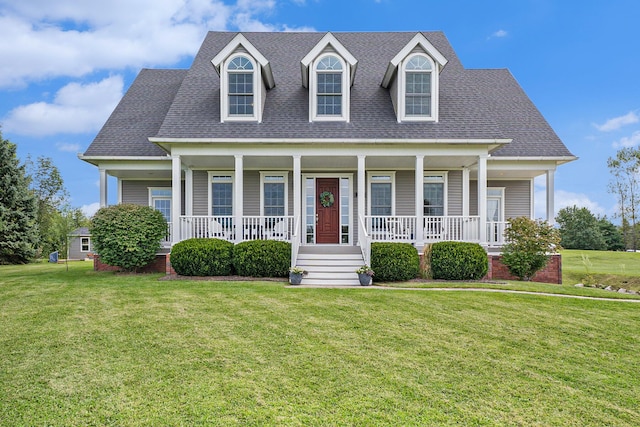 7812 Fountain Hills Ln, Davisburg, MI 48350 - new england style home featuring a front yard, a shingled roof, and covered porch