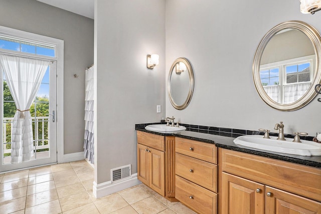 7812 Fountain Hills Ln, Davisburg, MI 48350 - bathroom with double vanity, baseboards, and tile patterned flooring