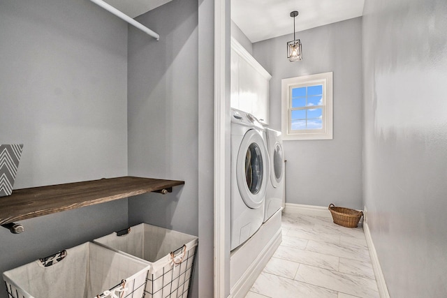7812 Fountain Hills Ln, Davisburg, MI 48350 - laundry area featuring cabinet space, marble finish floors, baseboards, and washer and dryer