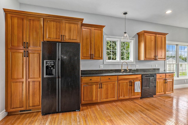 7812 Fountain Hills Ln, Davisburg, MI 48350 - kitchen with black appliances, a sink, brown cabinets, dark countertops, and recessed lighting