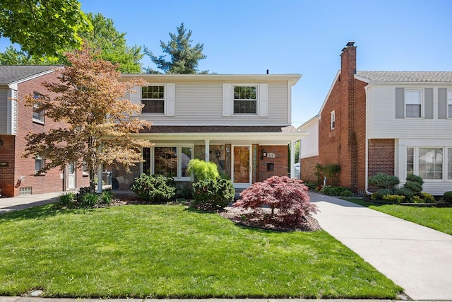 210 Robindale Ave, Dearborn, MI 48128 - view of front of property with a front lawn and driveway