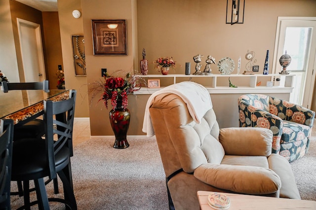 sitting room with carpet floors and baseboards