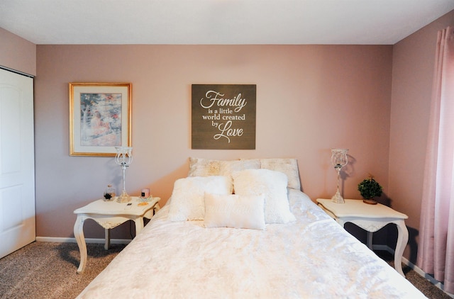 bedroom featuring carpet floors and baseboards