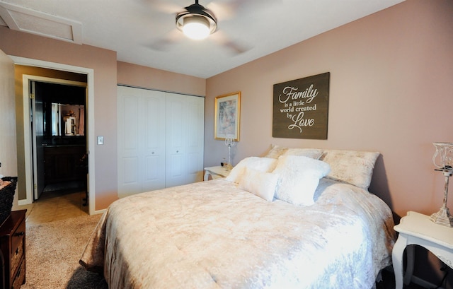 bedroom with a closet, attic access, a ceiling fan, and tile patterned floors