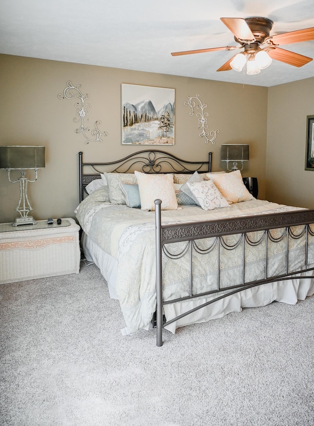carpeted bedroom with a ceiling fan