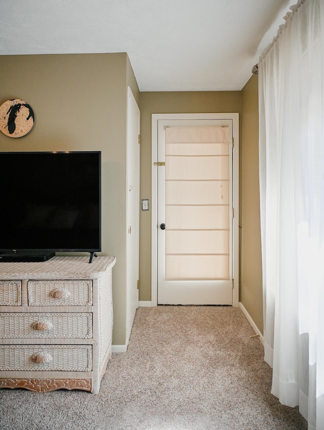carpeted bedroom with baseboards