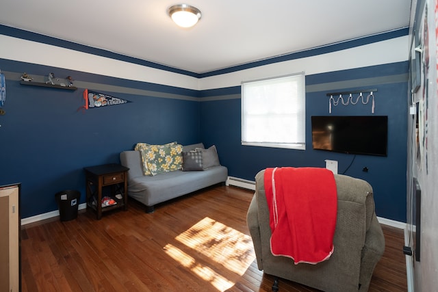 472 Central St, Marysville, MI 48040 - living area with a baseboard heating unit, wood finished floors, and baseboards