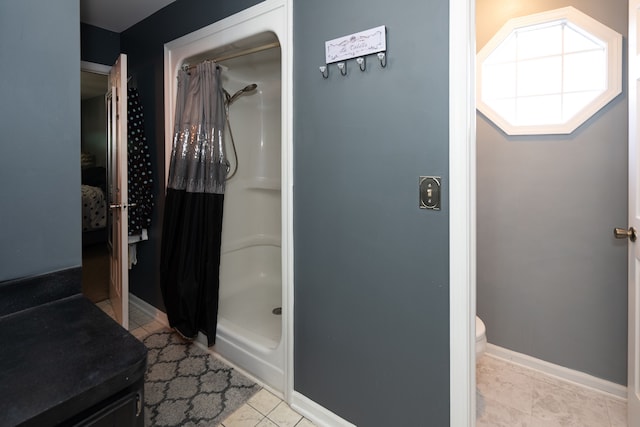 472 Central St, Marysville, MI 48040 - bathroom featuring a stall shower, tile patterned floors, and toilet