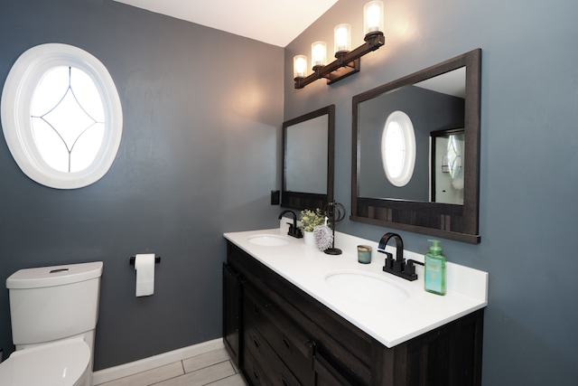 472 Central St, Marysville, MI 48040 - bathroom with toilet, baseboards, and double vanity