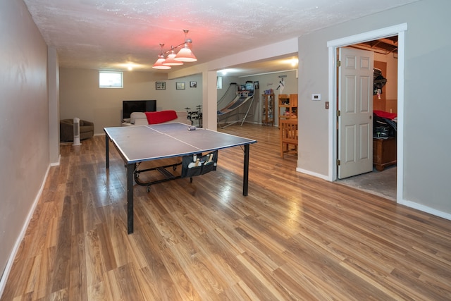 472 Central St, Marysville, MI 48040 - playroom featuring light wood-style floors, baseboards, and a textured ceiling