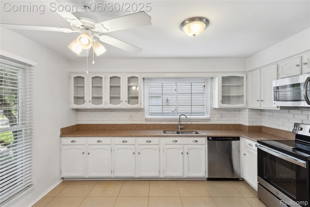16233 Birwood Ave, Beverly Hills, MI 48025 - kitchen featuring stainless steel appliances, a sink, decorative backsplash, and plenty of natural light