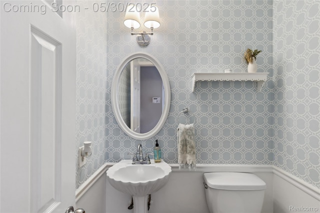 16233 Birwood Ave, Beverly Hills, MI 48025 - half bathroom featuring wallpapered walls, toilet, and a sink