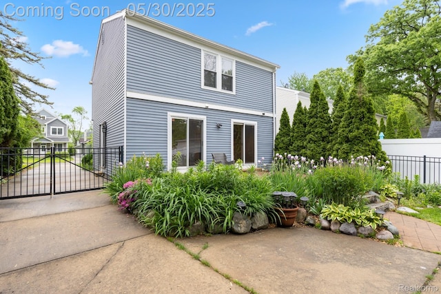 16233 Birwood Ave, Beverly Hills, MI 48025 - rear view of house with a gate and a patio