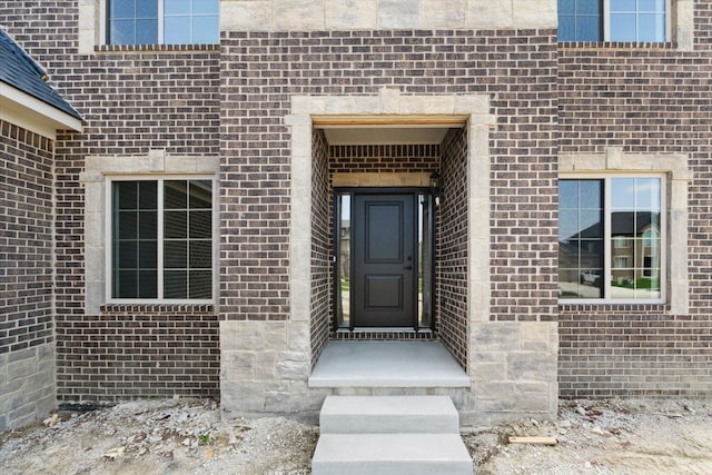 19266 Thompson Dr, Macomb, MI 48042 - view of exterior entry featuring brick siding