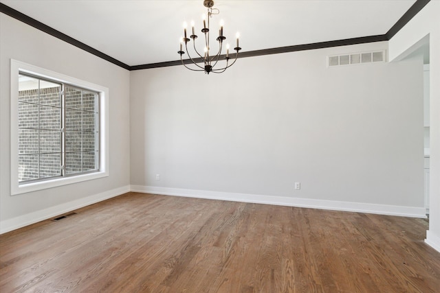 19266 Thompson Dr, Macomb, MI 48042 - spare room with crown molding, a chandelier, baseboards, and wood finished floors