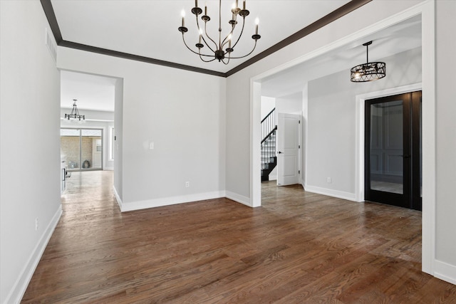 19266 Thompson Dr, Macomb, MI 48042 - unfurnished dining area with a chandelier, stairway, dark wood-style flooring, ornamental molding, and baseboards