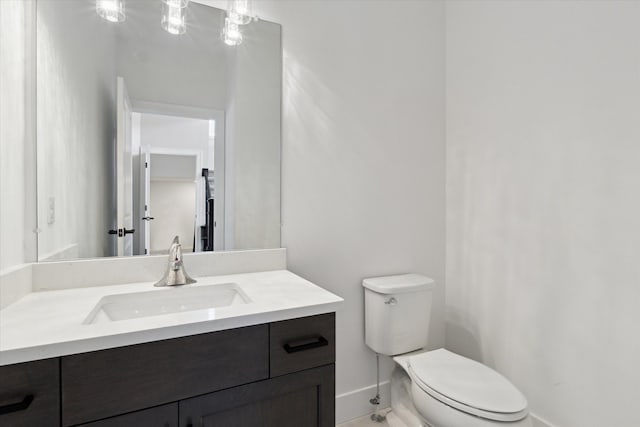19266 Thompson Dr, Macomb, MI 48042 - bathroom featuring baseboards, toilet, and vanity