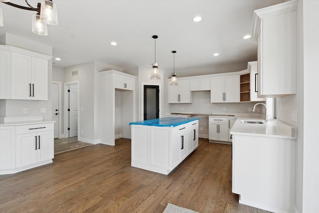 19266 Thompson Dr, Macomb, MI 48042 - kitchen featuring a sink, dark wood-style flooring, open shelves, recessed lighting, and white cabinetry