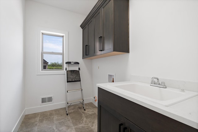 19266 Thompson Dr, Macomb, MI 48042 - washroom featuring cabinet space, baseboards, and washer hookup