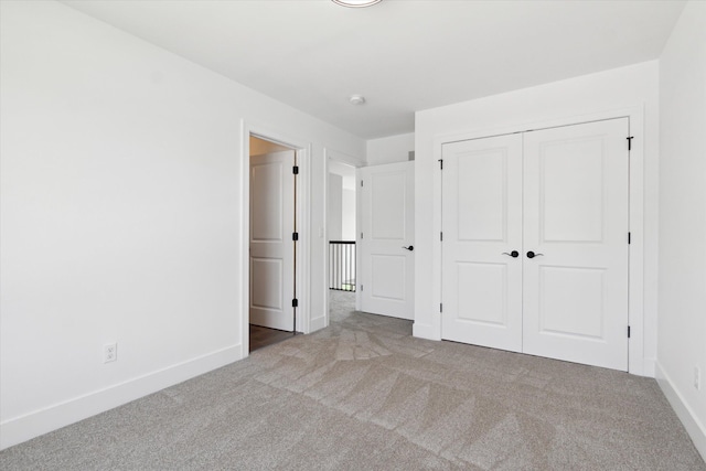 19266 Thompson Dr, Macomb, MI 48042 - unfurnished bedroom featuring carpet floors, baseboards, and a closet
