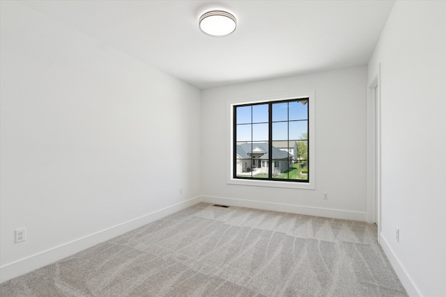 19266 Thompson Dr, Macomb, MI 48042 - unfurnished room with light carpet and baseboards