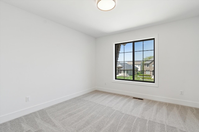 19266 Thompson Dr, Macomb, MI 48042 - empty room with carpet floors and baseboards