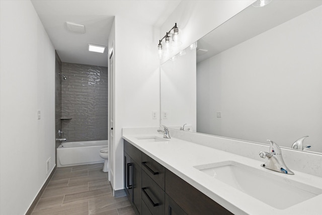 19266 Thompson Dr, Macomb, MI 48042 - full bath with toilet, double vanity, bathing tub / shower combination, and wood finished floors