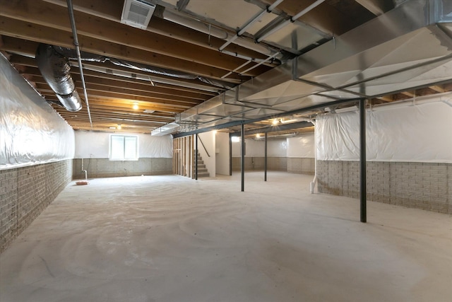 19266 Thompson Dr, Macomb, MI 48042 - basement featuring stairs and brick wall