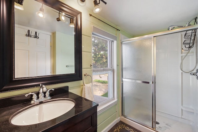 full bath featuring a shower stall and vanity