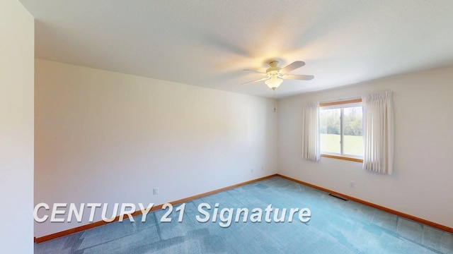 5966 Red Feather Dr, Bay City, MI 48706 - empty room with baseboards, carpet floors, and ceiling fan