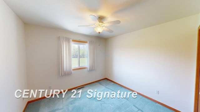 5966 Red Feather Dr, Bay City, MI 48706 - empty room featuring light carpet, baseboards, and ceiling fan