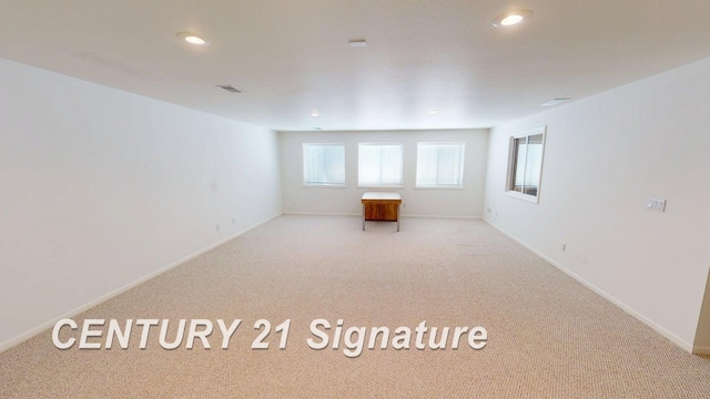5966 Red Feather Dr, Bay City, MI 48706 - carpeted empty room with recessed lighting and baseboards