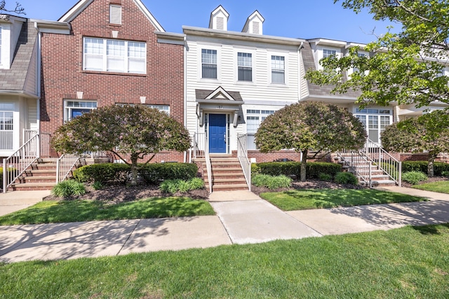 187 Center Blvd, Wixom, MI 48393 - view of property with brick siding