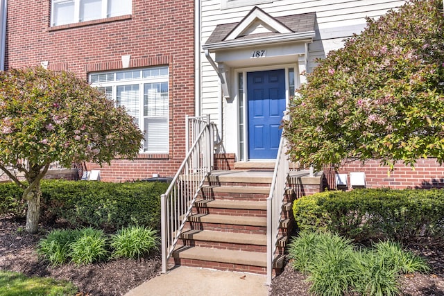 187 Center Blvd, Wixom, MI 48393 - view of exterior entry featuring brick siding