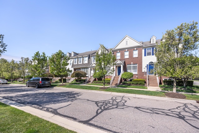 187 Center Blvd, Wixom, MI 48393 - view of front facade featuring brick siding
