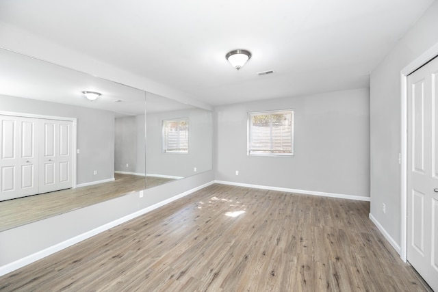 187 Center Blvd, Wixom, MI 48393 - unfurnished bedroom with wood finished floors and baseboards