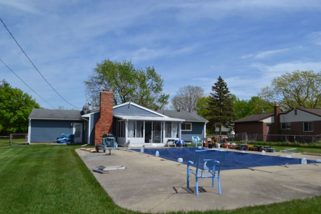5448 Fairview Dr, Grand Blanc, MI 48439 - view of pool featuring a sunroom and a patio area