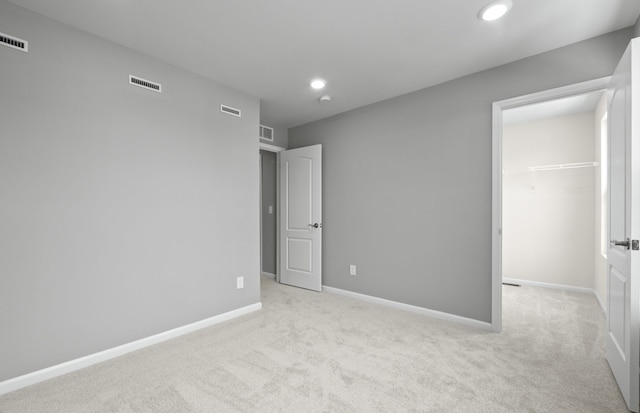 4076 Nottingham Cir, Clarkston, MI 48346 - unfurnished bedroom with a spacious closet, carpet flooring, recessed lighting, a closet, and baseboards